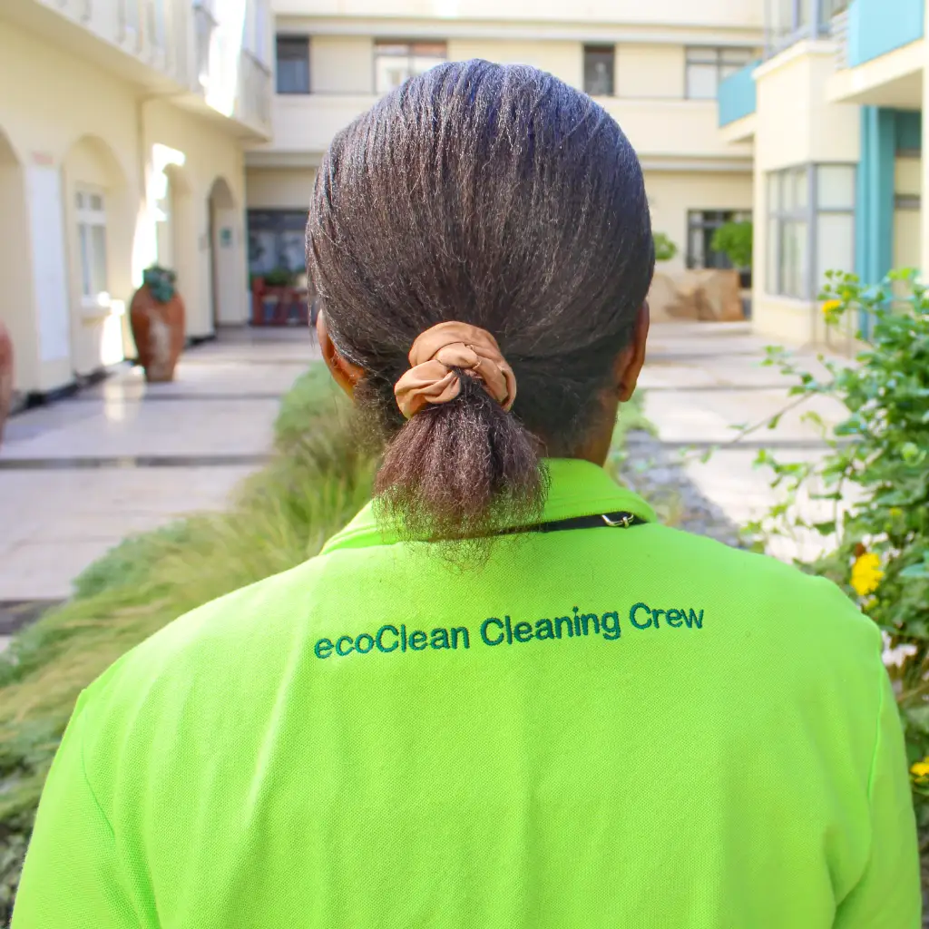 lady wearing green polo shirt with ecoclean embroidered on back